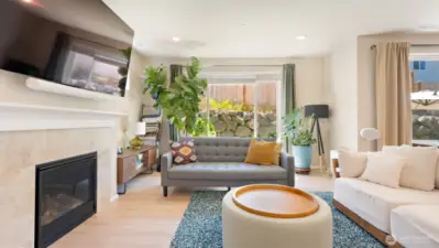 It's hard to think about now, but that gas fireplace will be so cozy in the winter! Today, you get to enjoy A/C, easy-care LVP floors, and tons of natural light!