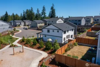 Such a perfect location in this fantastic neighborhood. You can see the umbrella on the side of the house... The house gets morning sun in the back yard and afternoon sun on the side yard next to the playground.