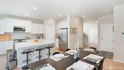 Back inside. Wow! It's such a gorgeous home. The double doors past the stairwell lead to the main-floor office.