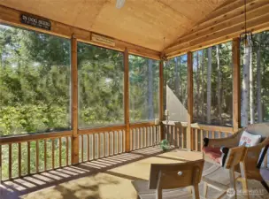 A side door off the great room leads to a screened porch, perfect for year-round entertaining.