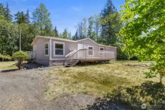 Home has nice deck area off front entry and features a brand new roof!
