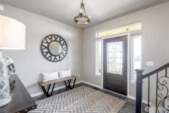 A warm and refined entryway sets the tone for coastal charm and timeless elegance.