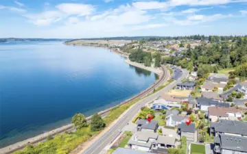 Perched above the shoreline with sweeping Puget Sound views and Chambers Bay Golf course.