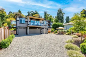 Elevated coastal living with expansive decks, manicured grounds, and a rare separate guest retreat.