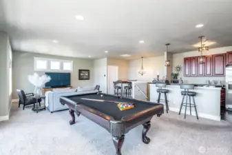 Thoughtfully designed ADU offers a full bar, lounge space, and room for serious pool-table bragging rights.