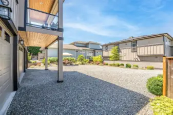 Expansive parking, lush landscaping, and a sun-drenched outdoor retreat welcome you to coastal serenity.