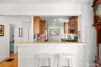 This photo shows the breakfast bar, perfect for any informal meals that may be part of a morning routine. It can  serve as a sitting area to watch and visit with the chef as the meal comes together. This breakfast bar makes a perfect buffet area so that guests may help themselves to hors d'ouevres before dinner if you prefer.