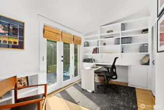 The primary bedroom has French Doors looking out over the beautiful landscaping and plantings of the backyard and deck. The floors in this bedroom are hardwoods as is the flooring in the rest of the house.