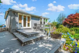 This is the rear deck, situated just off the primary bedroom's French doors. There is room here for a patio table & chairs.