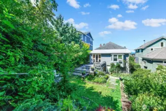 There is privacy landscaping surrounding this backyard as you can see from this photo.