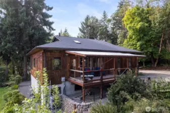 Huge covered porch and front deck (one of three) as you enter