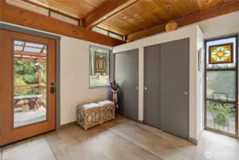Large entry, wood planked ceilings and plenty of storage