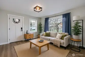 Lovely living room is digitally staged to give you design inspiration! Existing curtains stay in home.