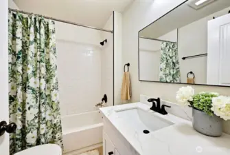 Full bath on main level was recently remodeled. Digitally staged.