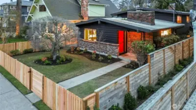 Mid century modern classic with new fence, secure gate and mature garden. Spring bulbs to come!