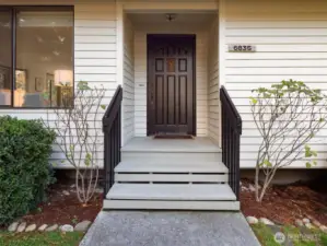 A welcoming entry framed by thoughtful landscaping and natural light sets the tone for this calm Newcastle retreat.