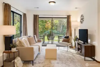 A comfortable Garden Level Family Room designed for casual living with sliding doors that extend the space onto the broad backyard lawn.