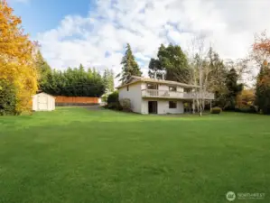 This wide open half acre supports recreation, relaxation and creativity with level ground suited for play areas, gardens, outdoor studios or future expansion.