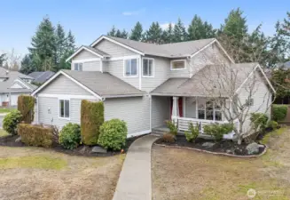 Beautiful corner lot home with attached garage in the back.