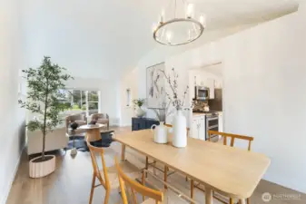 Open flow connects dining with main living areas.