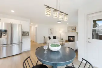 Casual dining area with access to the patio and backyard.