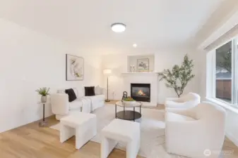 Comfortable family room anchored by a gas fireplace.