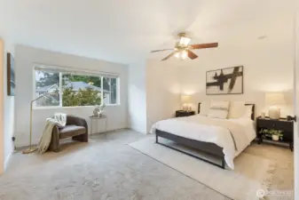 Spacious primary suite offers a true retreat.