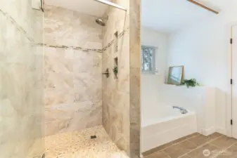 Separate shower offers modern functionality, while a soaking tub invites relaxation.