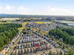 Top left of the photo- that open green space just outside the neighborhood- is a city park- walking distance from the home.