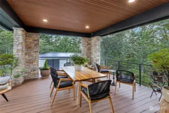 At the end of the day, the huge view from your upper deck shows off the sunset over the Olympics and Hood Canal. The garden shed seen here above holds the things needed to grow organic food, both built just for this place.