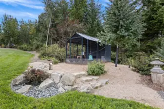 Walk past the hen house, up the side of the ravine and come out at the greenhouse and garden.