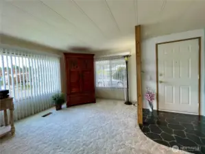 Living room with a view of the front entry.