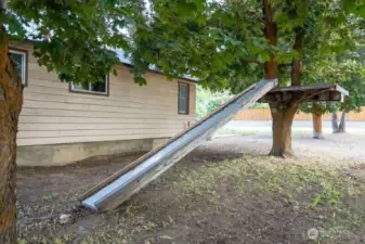 Generous Maple trees on West side of this home.