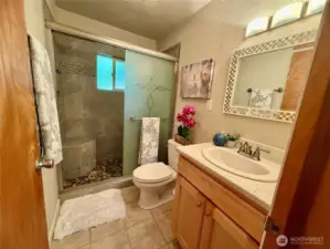 Updated bathroom w/ beautiful shower and stunning tile work.