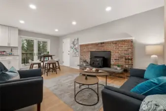 The family room, off the entry, the kitchen and French doors out to the deck.