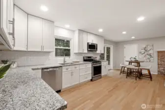 Lots of white modern cabinets & granite counters!