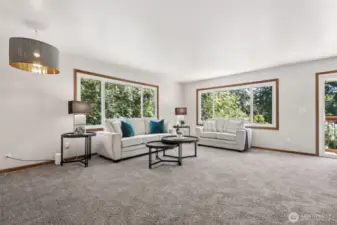 There's so much room in this "formal" living room! And look at those gorgeous, large vinyl windows carrying the outdoors, inside!