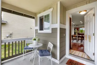 Nice sized covered front porch, entry and half bath to your right, dining area seen at center to the kitchen.