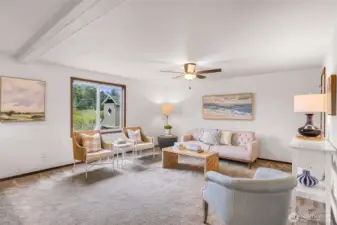 Playhouse and nature greenbelt enjoyed through the large living room window.  This living room is ready for your own touches.