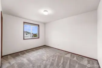 Bedroom #2 has one large west facing window and a walk in closet to your left.