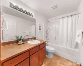 Full bathroom on the upper level for bedroom #1 and #2.  Across the hall, don't miss the pantry closet with doors for all your bathroom/linens storage needs.