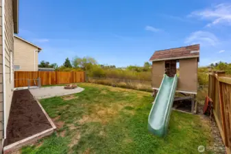 Flower or garden bed along the house is ready for your vision and back yard is private, facing the greenbelt.