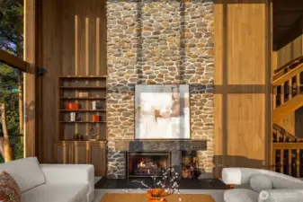 Cozy 15ft. wood burning fireplace and a custom built-in bookcase.