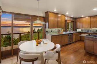 Dining room features a new door that leads out to the main level deck.