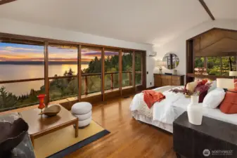 Primary bedroom upstairs, opens up to the dining room and living room. Custom doors may be shut for privacy.