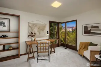 Bedroom on the main features new carpet, floor-to-ceiling windows that look out to a view.