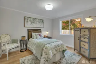 But continuing down the hallway, you'll find this bedroom on the left and a linen closet at the end of the hallway and on the right...