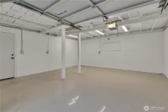 Inside the garage is super clean!  Polycurmine floor, new wiring, lighting and it has its own sub-panel.  The attic pull-down is...