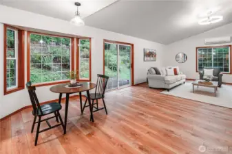 Open concept living space boasts seamless flow between kitchen, dining and living areas, complemented by fresh new interior paint and new LVP flooring.