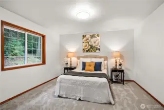 Primary bedroom updated with fresh paint, new carpet and plenty of natural light.